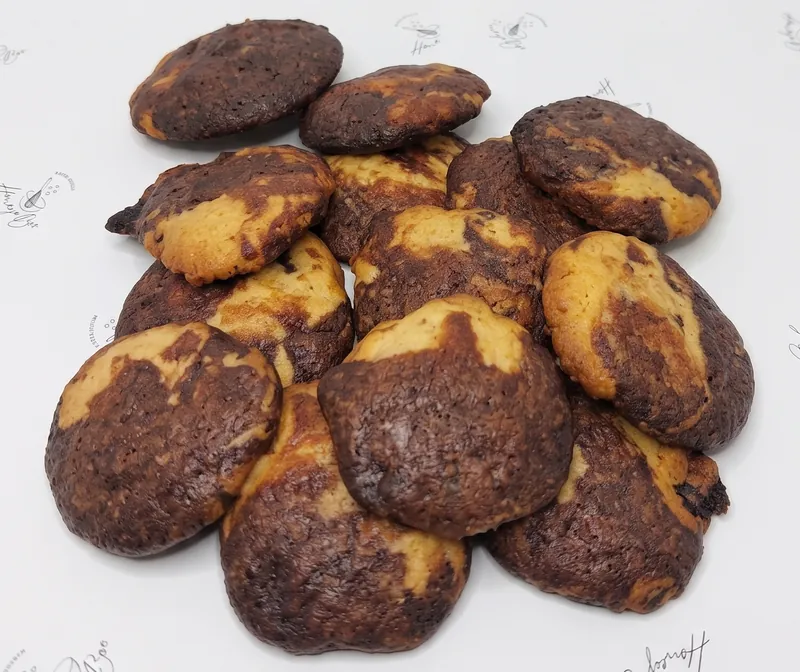 A pile of brookies — half chocolate brownie, half vanilla cookie